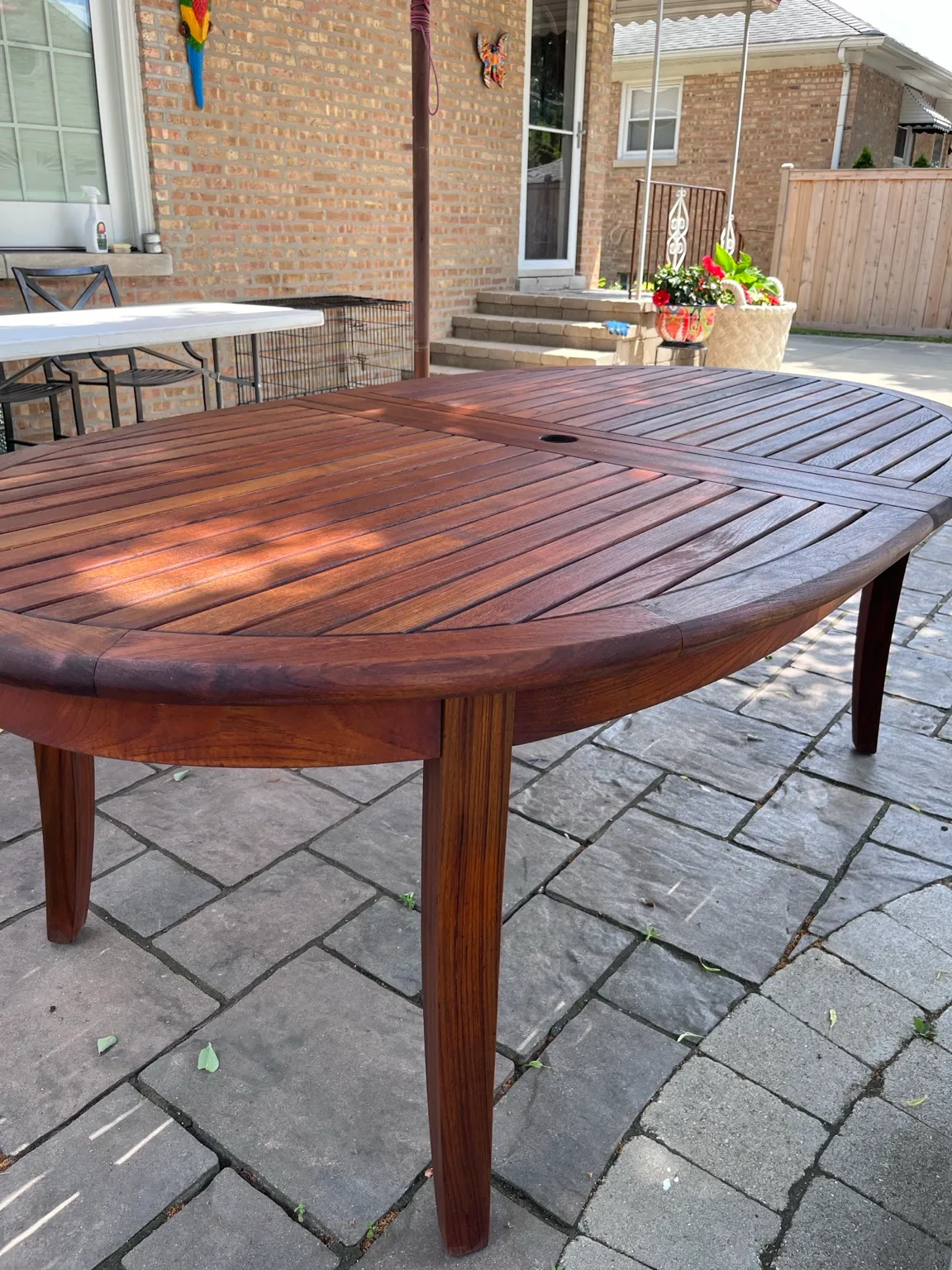 Restored oval slatted wood outdoor table